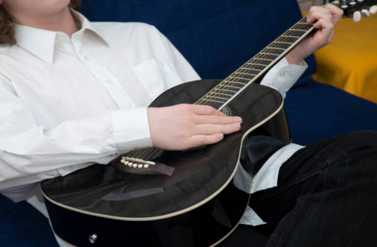 Strumming to Success: Expert Guitar Lessons for Advancing Players